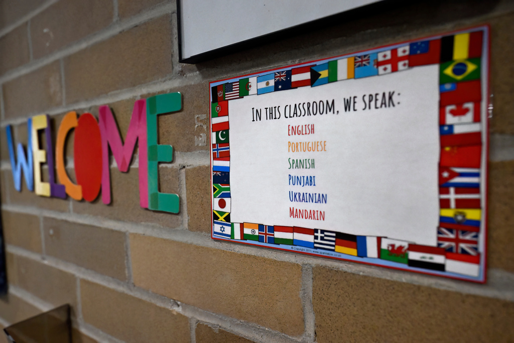 A sign posted outside Kindergarten teacher Christin Labriola's classroom shows the diverse population of her students at Webster Hill Elementary School in West Hartford, Conn., on Dec. 2, 2025. (AP Photo/Jessica Hill)