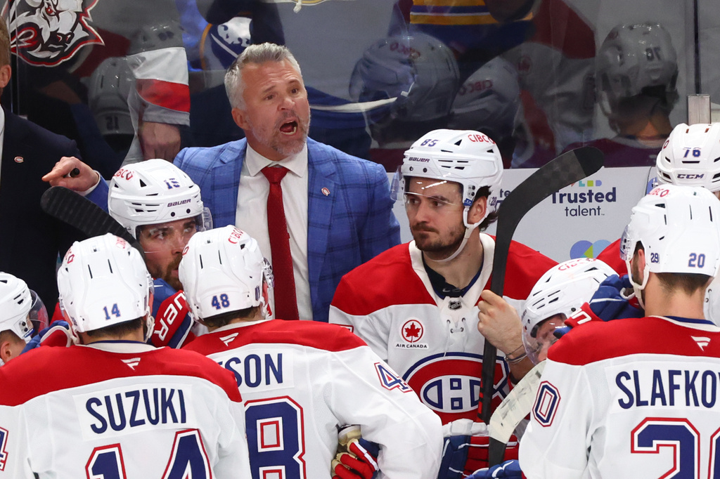 Montreal Canadiens head coach Martin St-Louis talks with team during the third period in Game 1 of a second-round NHL hockey Stanley Cup playoff series against the Buffalo Sabres Wednesday, May 6, 2026, in Buffalo, N.Y. (AP Photo/Jeffrey T. Barnes)