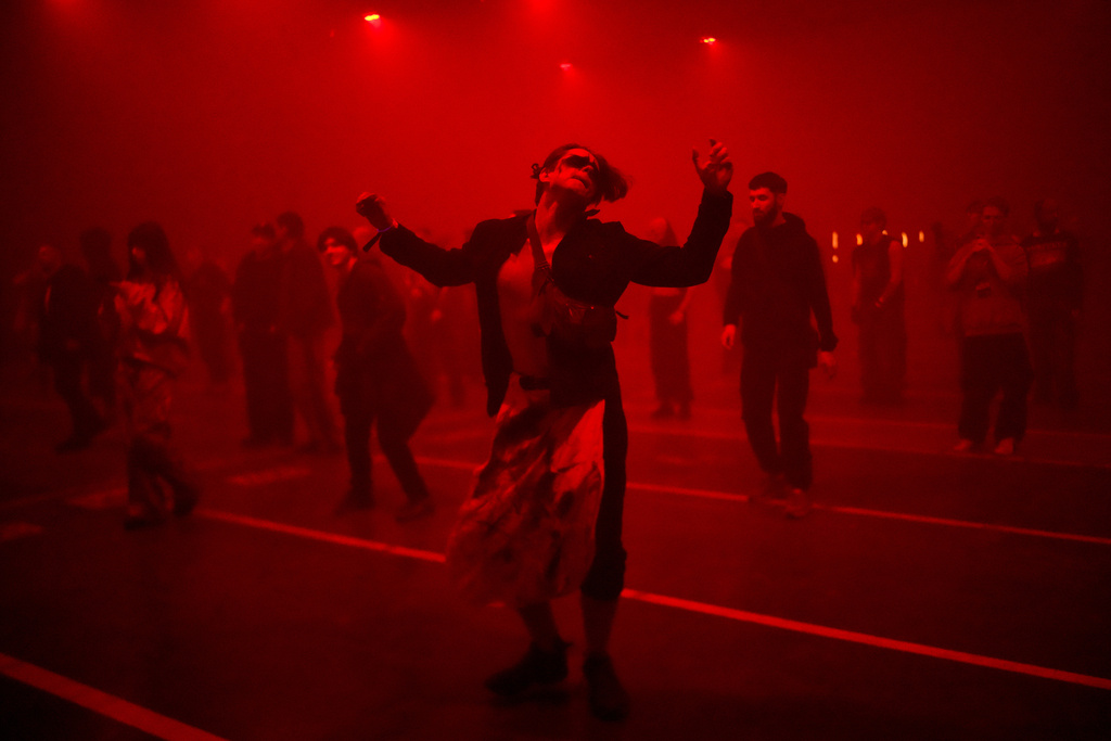 Aperson dances during a Halloween rave in Kyiv, Ukraine, Saturday, Oct. 25, 2025. (AP Photo/Julia Demaree Nikhinson)