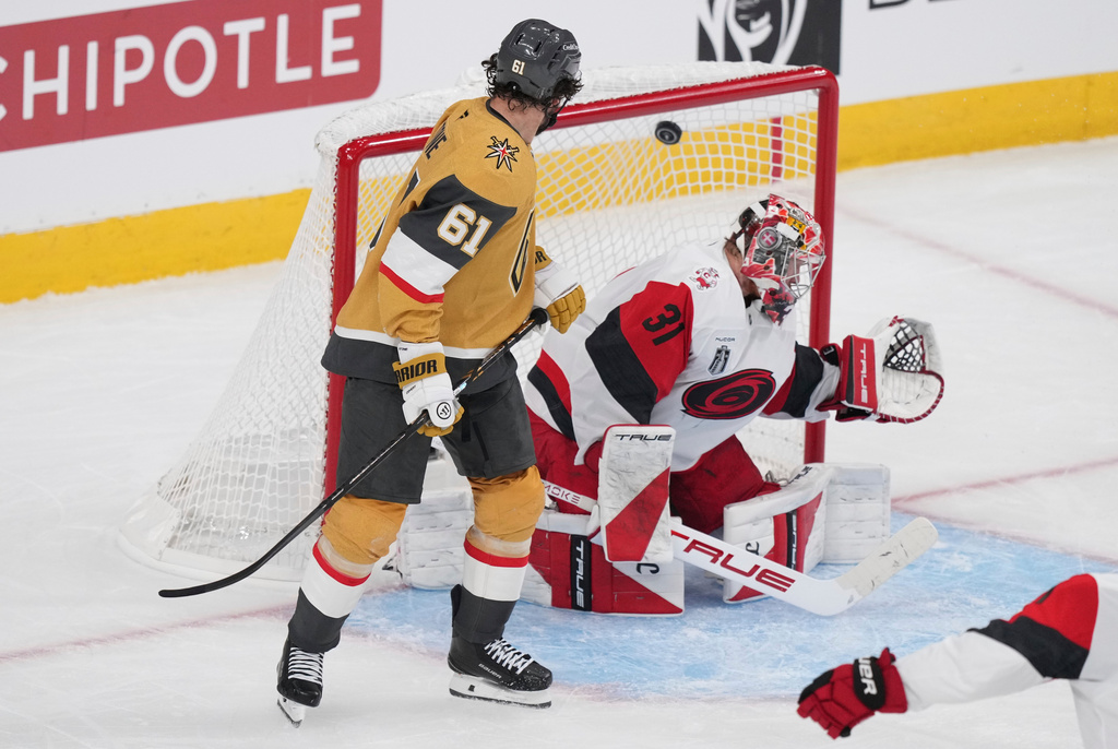 Carolina Hurricanes goaltender Frederik Andersen, right, is scored on by Vegas Golden Knights center Tomas Hertl as right wing Mark Stone, left, watches during the second period in Game 3 of the NHL hockey Stanley Cup Final series Saturday, June 6, 2026, in Las Vegas. (AP Photo/Candice Ward)