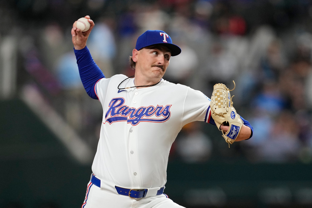 Texas Rangers relief pitcher Peyton Gray throws his first pitch in his major league debut to Pittsburgh Pirates' Nick Gonzales in the ninth inning of a baseball game Thursday, April 23, 2026, in Arlington, Texas. (AP Photo/Tony Gutierrez)
