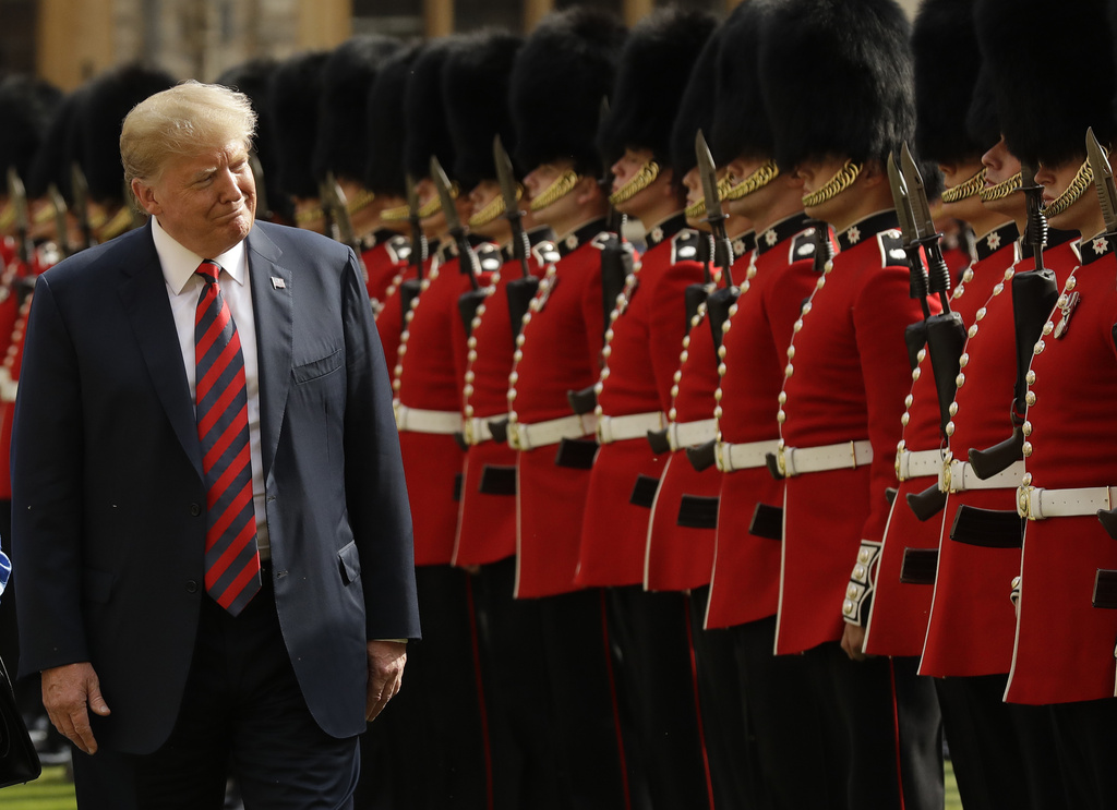 FILE - U.S. President Donald Trump inspects a Guard of Honour, formed of the Coldstream Guards at Windsor Castle in Windsor, England, Friday, July 13, 2018. (AP Photo/Matt Dunham, Pool, File)