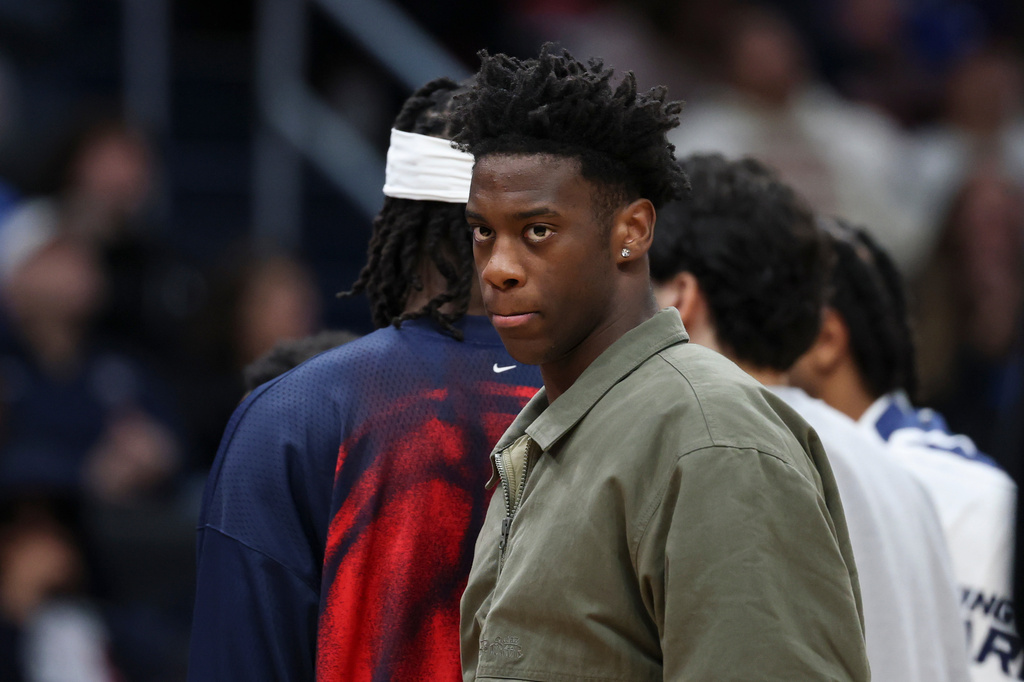 Washington Wizards forward AJ Dybantsa looks on while wearing street clothes during an NBA basketball game against the Toronto Raptors in Washington, Friday, Oct. 23, 2026. (AP Photo/Terrance Williams)