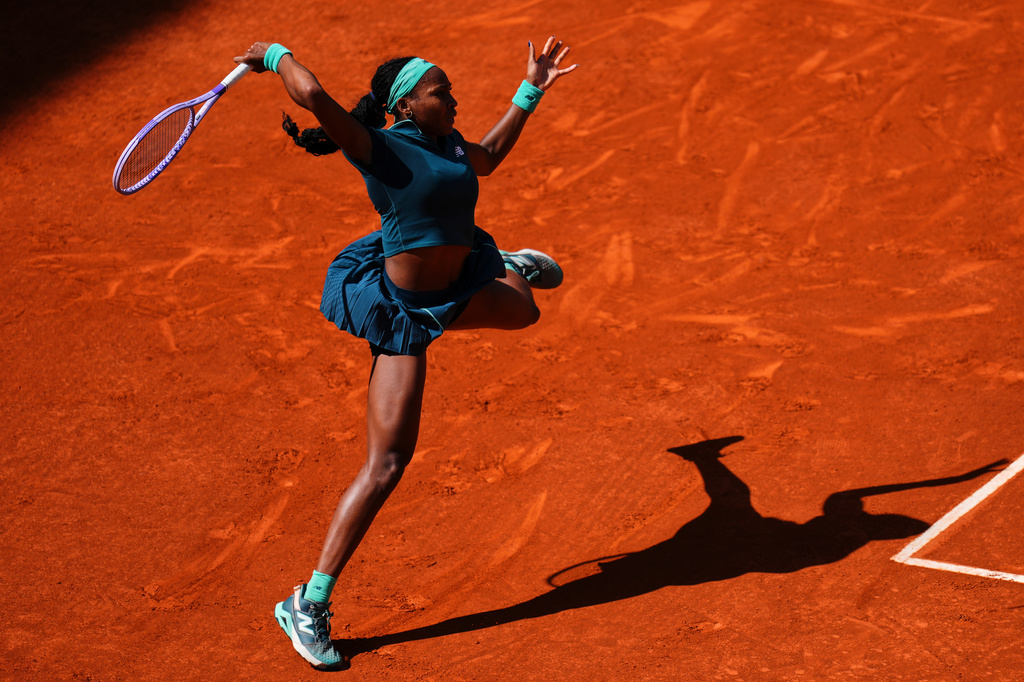 Coco Gauff of the U.S. returns the ball to Sorana Cirstea of Romania during the Madrid Open tennis tournament in Madrid, Sunday, April 26, 2026. (AP Photo/Manu Fernandez)