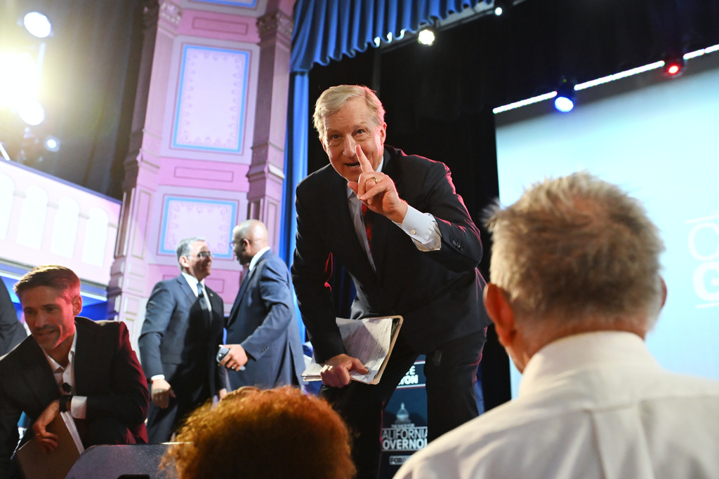 Tom Steyer, right, and Matt Mahan talk to attendees after the California gubernatorial candidate debate Tuesday, Feb. 3, 2026, in San Francisco. (AP Photo/Laure Andrillon)
