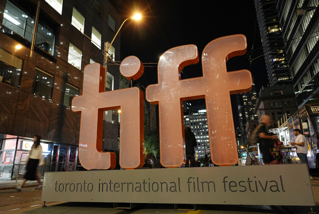 FILE - A sign for the Toronto International Film Festival appears on the opening night of the festival in Toronto on Sept. 5, 2024. (AP Photo/Chris Pizzello, File)