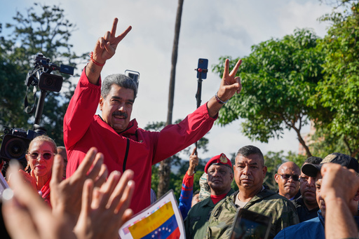 FILE - President Nicolas Maduro flashes victory signs during Indigenous Day in Caracas, Venezuela, Oct 12, 2025. (AP Photo/Ariana Cubillos, File) FILE - President Nicolas Maduro flashes victory signs during Indigenous Day in Caracas, Venezuela, Oct 12, 2025. (AP Photo/Ariana Cubillos, File)