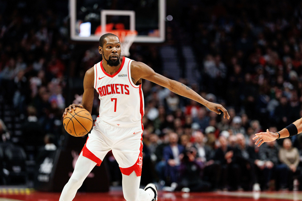 Houston Rockets forward Kevin Durant dribbles during the second half of an NBA basketball game against the Portland Trail Blazers, Friday, Jan. 9, 2026, in Portland, Ore. (AP Photo/Howard Lao)