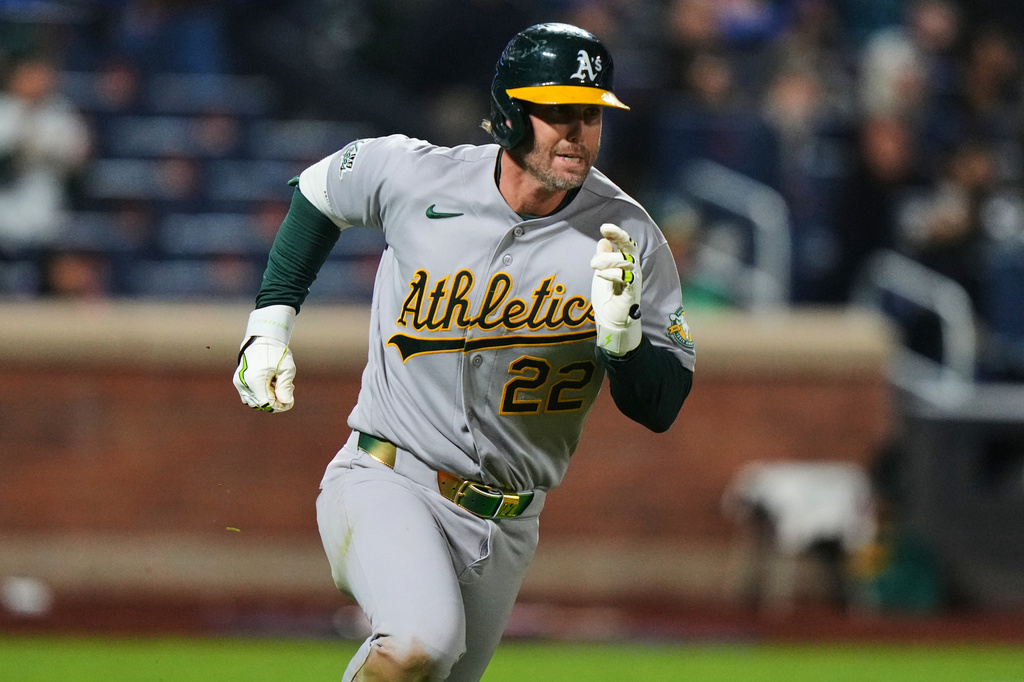 Athletics' Jeff McNeil (22) runs to first base for an RBI single during the ninth inning of a baseball game against the New York Mets Friday, April 10, 2026, in New York. (AP Photo/Frank Franklin II)