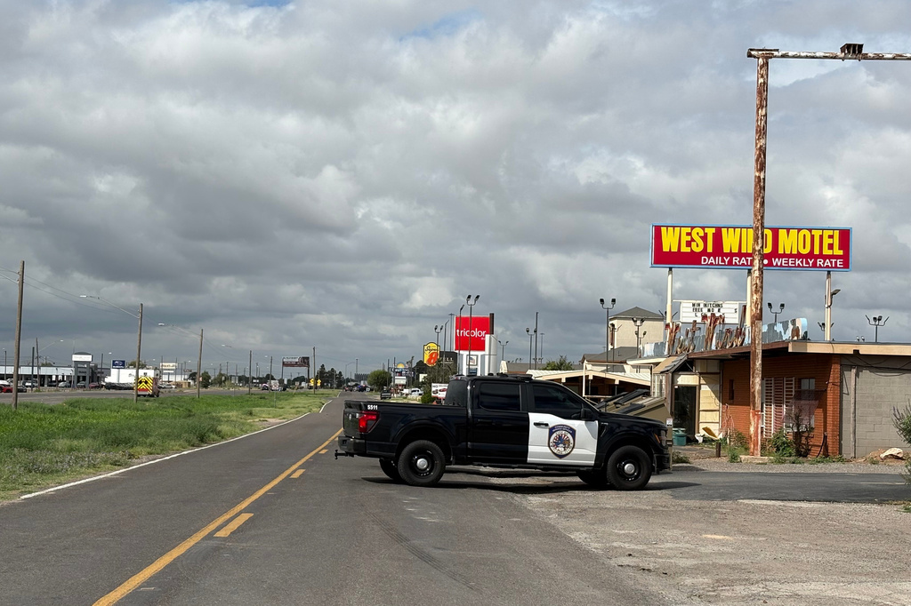 Law enforcement responds to an active shooting scene Friday, June 12, 2026, in Midland, Texas. (Luke Dias/Reporter-Telegram via AP)