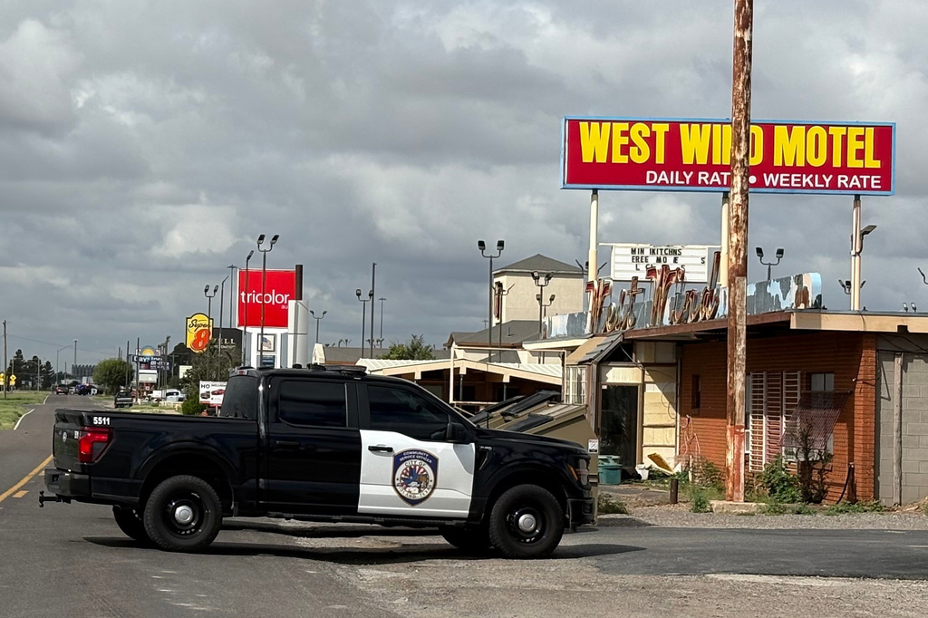 Law enforcement responds to an active shooting scene Friday, June 12, 2026, in Midland, Texas. (Luke Dias/Reporter-Telegram via AP)