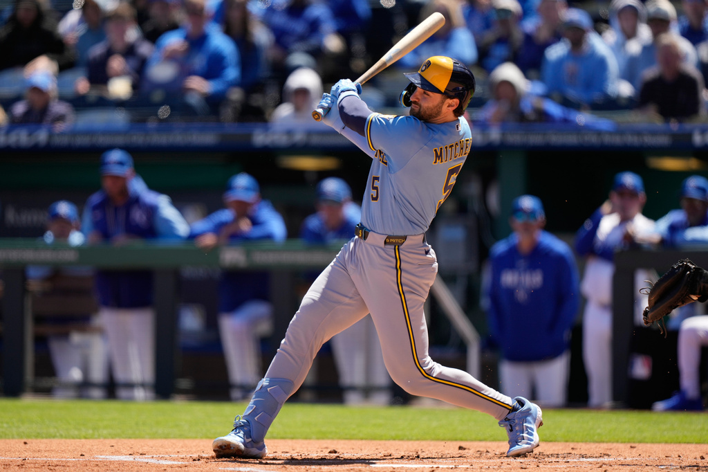 Milwaukee Brewers' Garrett Mitchell watches his two-run double during the first inning in the first baseball game of a doubleheader against the Kansas City Royals, Saturday, April 4, 2026, in Kansas City, Mo. (AP Photo/Charlie Riedel)