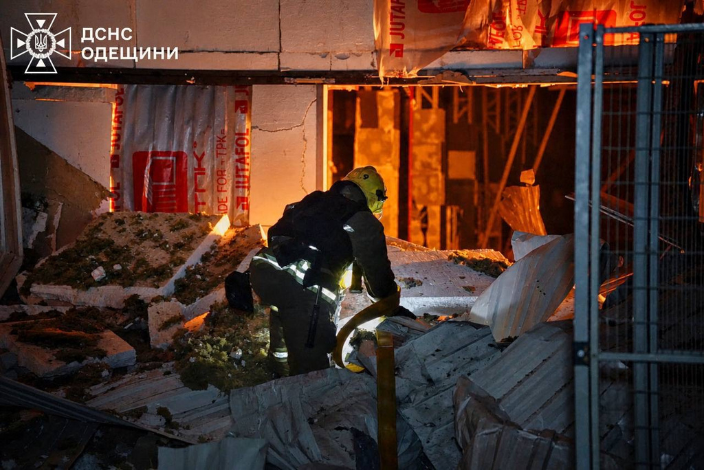 A Ukrainian emergency worker looks through rubble after Russia attacked Ukraine's Odesa region overnight on Sunday, May 3, 2026. (Ukrainian Emergency Service via AP)