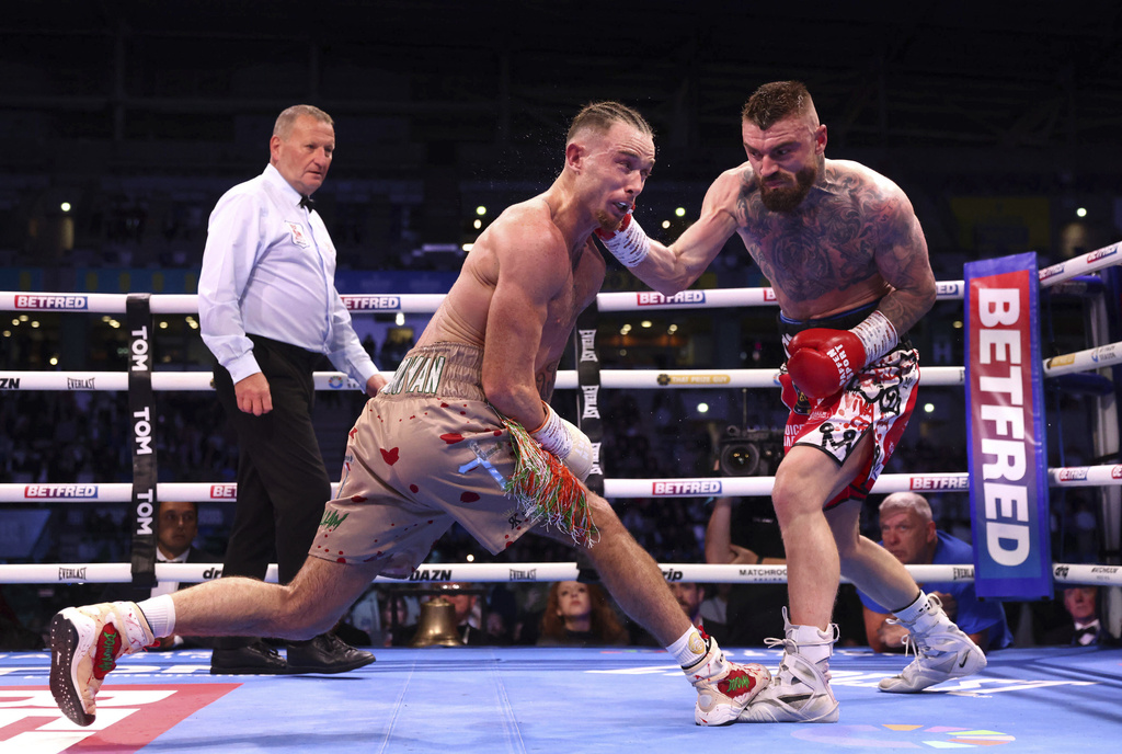 Lewis Crocker, right, punches Paddy Donovan battle during an IBF world welterweight bout at the SSE Arena, Saturday, Sept. 13, 2025, in Belfast, Northern Ireland. (Peter Morrison/PA via AP)