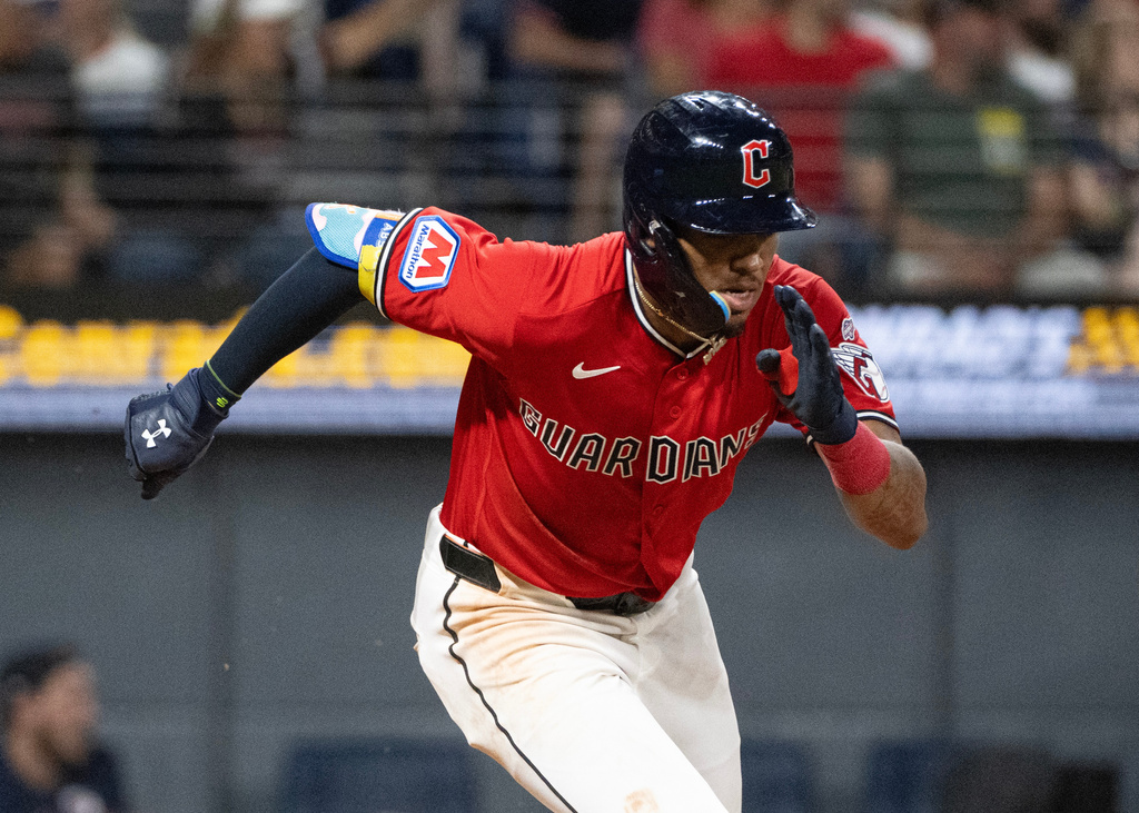 Cleveland Guardians' Angel Genao heads to first base after a one-run single off New York Mets relief pitcher Dedniel Nunez for his first Major League RBI during the seventh inning of a baseball game, Wednesday, Aug. 5, 2026, in Cleveland. (AP Photo/Phil Long)