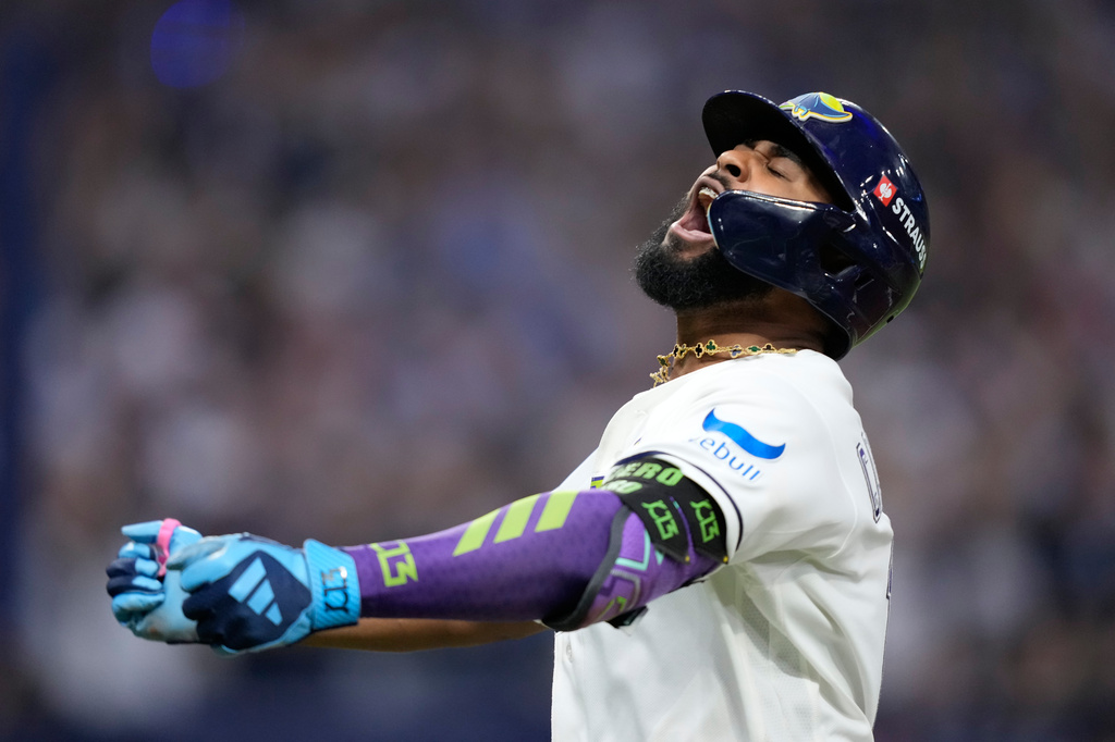 Tampa Bay Rays' Junior Caminero celebrates a two-run home run against the Cleveland Guardians during the seventh inning in Game 6 of an American League Championship Series baseball game in St. Petersburg, Fla. Monday, Oct. 19, 2026. (AP Photo/David J. Phillip)