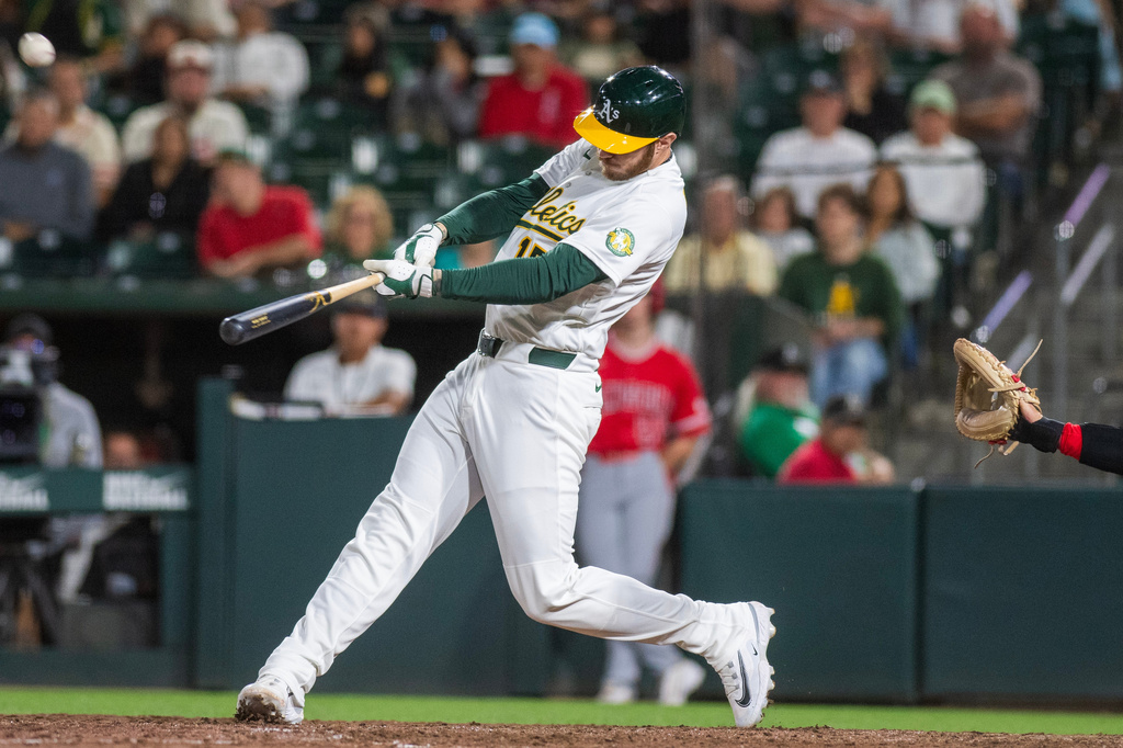 Athletics' Jonah Heim hits a home run during the ninth inning of a baseball game against the Los Angeles Angels in West Sacramento, Calif., Friday, June 19, 2026. (AP Photo/Nic Coury)