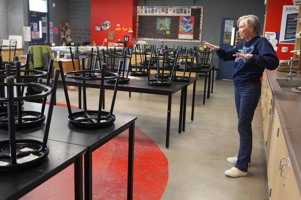 Art teacher Joyce Hatzidakis gets ready to welcome students in her classroom Thursday, Jan. 22, 2026, Riverside, Calif. (AP Photo/Damian Dovarganes)