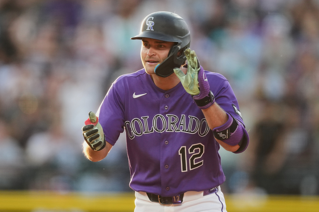 Colorado Rockies' Kyle Karros celebrates after reaching second base on a two-run double off Miami Marlins starting pitcher Sandy Alcantara in the third inning of a baseball game Monday, June 29, 2026, in Denver. (AP Photo/David Zalubowski)