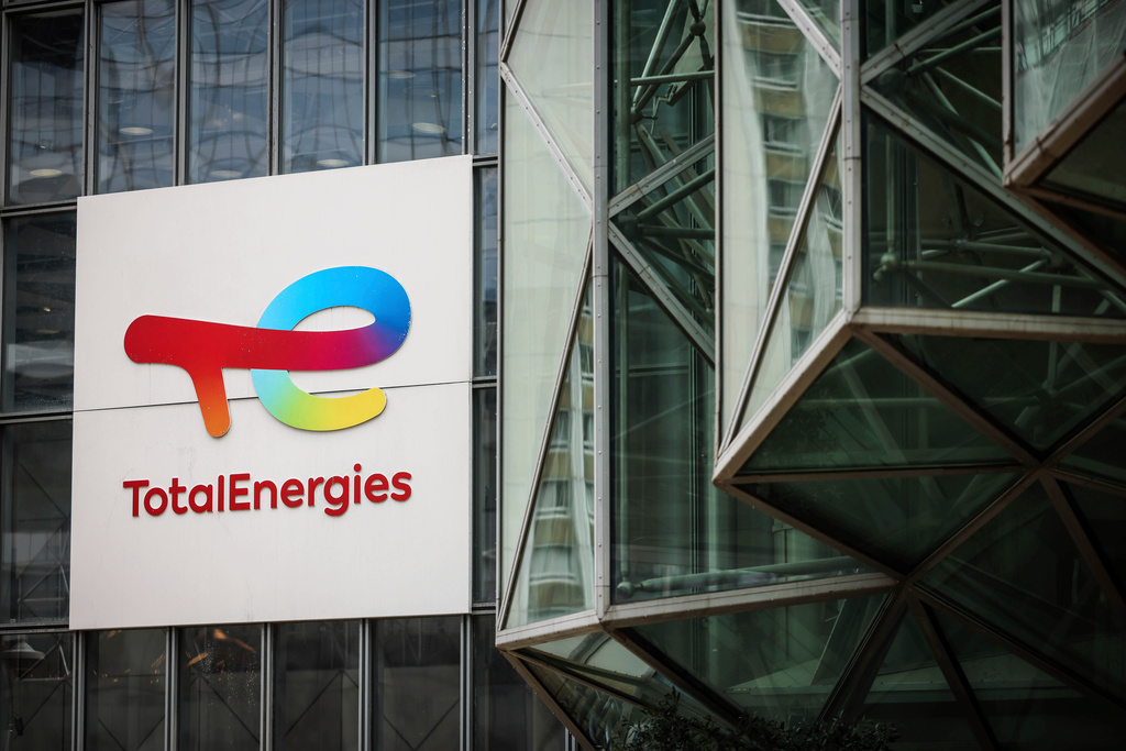 FILE - A sign for the French company TotalEnergies is displayed at headquarters March 21, 2025, in La Defense business district outside of Paris. (AP Photo/Thomas Padilla, File)