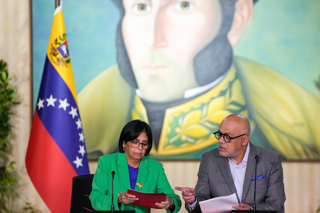 FILE - Venezuelan Vice President Delcy Rodriguez meets with her brother, National Assembly President Jorge Rodriguez at the Foreign Ministry in Caracas, Venezuela, Dec. 11, 2023. (AP Photo/Matias Delacroix, File)
