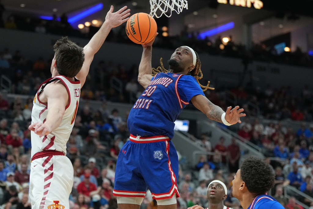 Tennessee State's Aaron Nkrumah (30) heads to the basket as Iowa State's Nate Heise, left, defends during the first half in the first round of the NCAA college basketball tournament, Friday, March 20, 2026, in St. Louis. (AP Photo/Jeff Roberson)