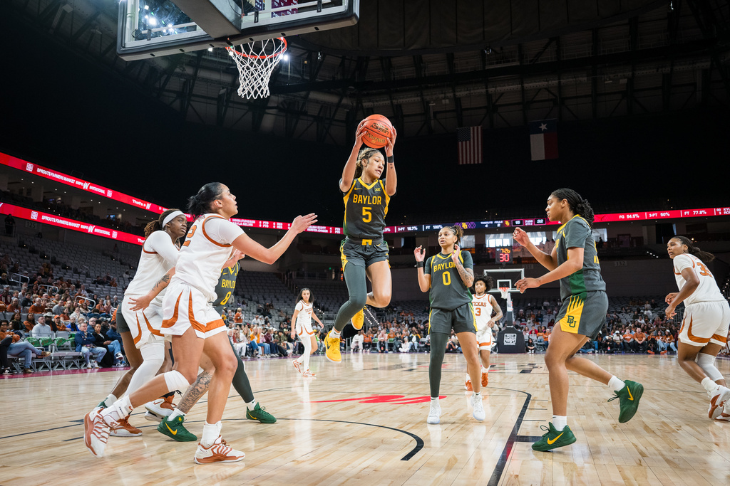 Baylor forward Darianna Littlepage-Buggs (5) snags a rebound during an NCAA college basketball game against Texas, Sunday, Dec. 14, 2025, Fort Worth, Texas. (AP Photo/Jessica Tobias)