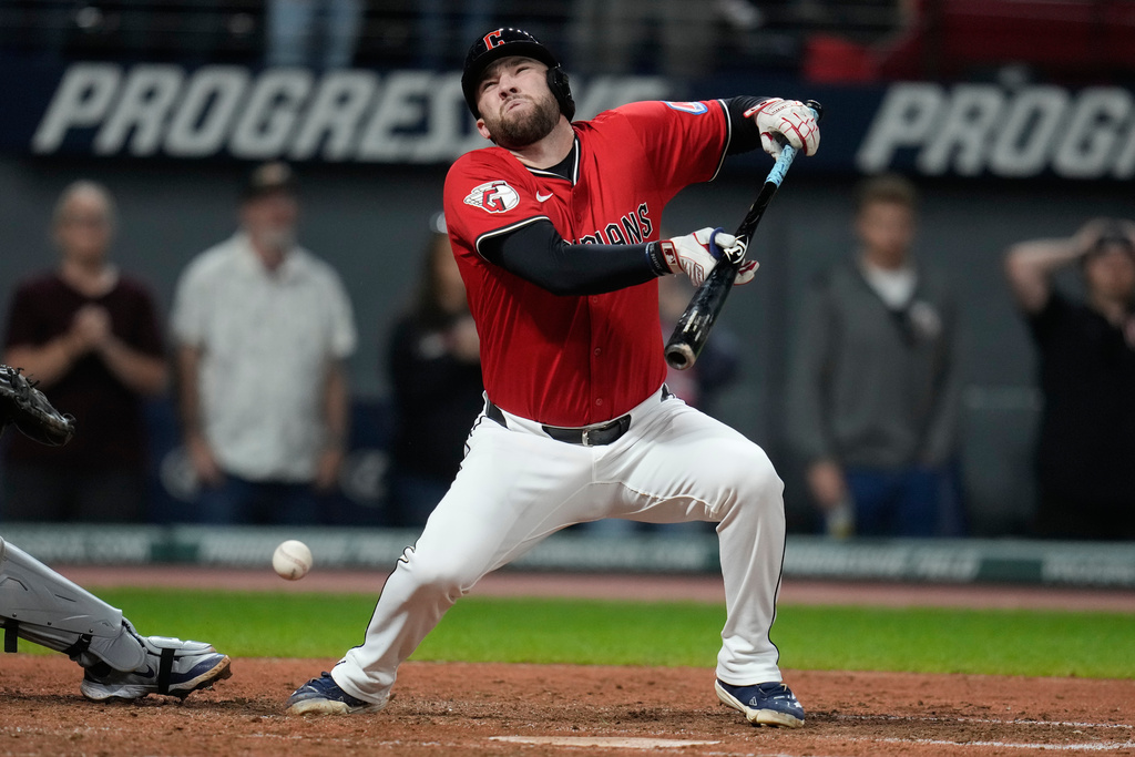 CORRECTION CORRECTS HITTING ON THE FACE BY PITCH - Cleveland Guardians' David Fry falls back after being hit in the face by a pitch in the sixth inning of a baseball game against the Detroit Tigers in Cleveland, Tuesday, Sept. 23, 2025. (AP Photo/Sue Ogrocki)