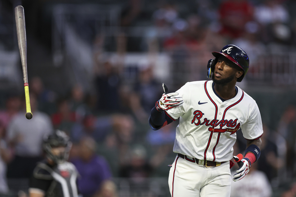 Atlanta Braves' Jurickson Profar flips his bat after hitting a two-run home run in the fourth inning of a baseball game against the Chicago White Sox, Tuesday, Aug. 19, 2025, in Atlanta. (AP Photo/Colin Hubbard)