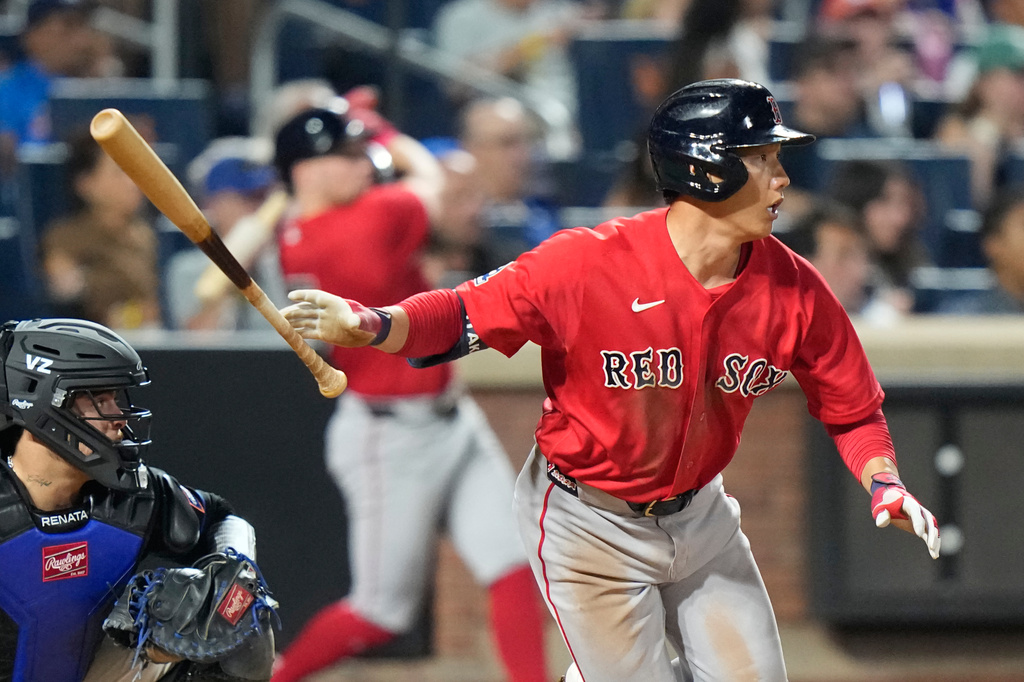 Boston Red Sox's Masataka Yoshida follows through on a double during the seventh inning of a baseball game against the New York Mets Friday, July 10, 2026, in New York. (AP Photo/Frank Franklin II)