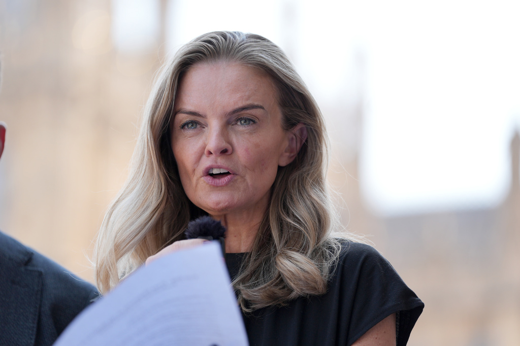 Laura Enston, granddaughter of Ruth Ellis, makes a statement to the media outside the Houses of Parliament, London, Wednesday July 8, 2026, as Ruth Ellis, the last woman executed in Britain, was posthumously granted a conditional pardon. (Annabel Lee-Ellis/PA via AP)