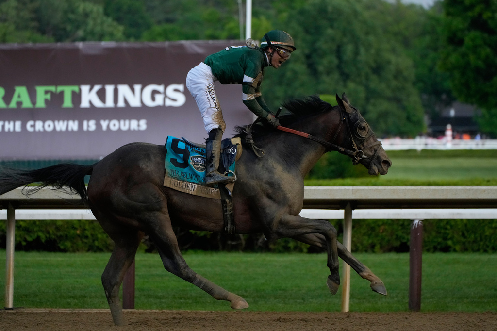 Golden Tempo (9) with Jockey Jose Ortiz crosses the finish line to win the 158th running of the Belmont Stakes horse race, Saturday, June 6, 2026, in Saratoga Springs, N.Y. (AP Photo/Yuki Iwamura)