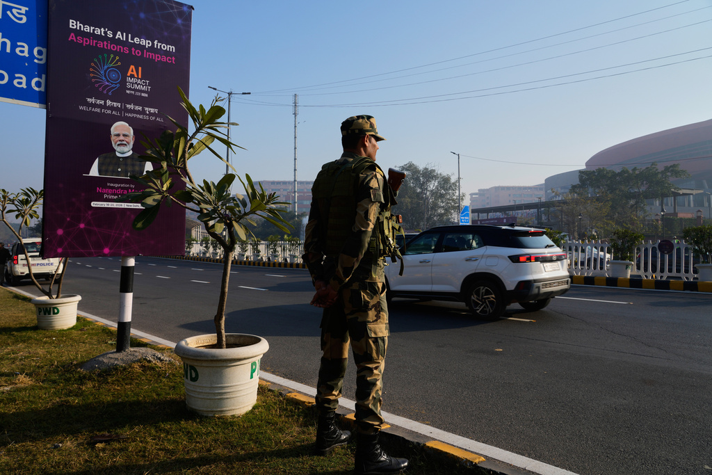 An Indian para-military force soldier stands guard outside the venue of AI-Summit in New Delhi, India, Monday, Feb. 16, 2026. (AP Photo/Manish Swarup)