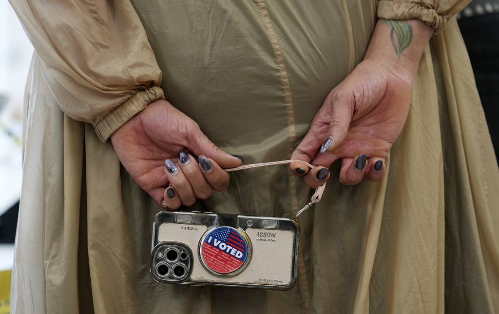 Chris Pizzello Marsha Molinari of West Hollywood, Calif., holds a cell phone at a polling place at the Connie Norman Transgender Empowerment Center on Election Day, Tuesday, Nov. 5, 2024, in West Hollywood, Calif. (AP Photo/Chris Pizzello)
