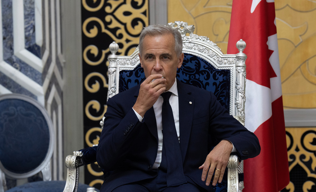 Canada Prime Minister Mark Carney drinks a coffee as he participates in a welcome ceremony in Jeddah, Saudi Arabia, Wednesday, July 8, 2026. (Adrian Wyld/The Canadian Press via AP)