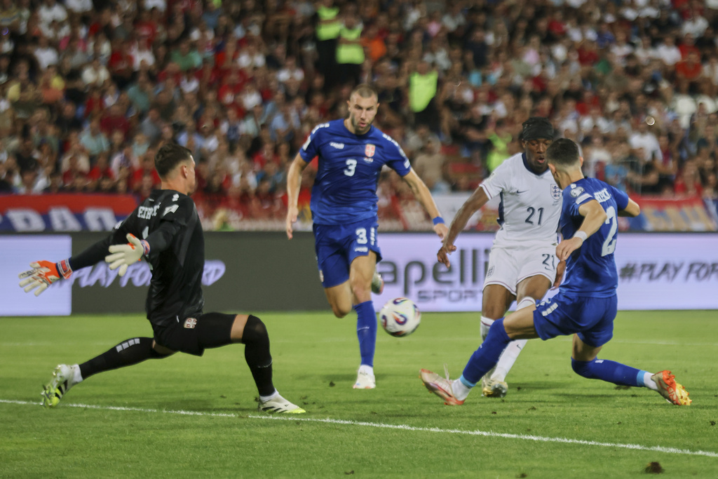 England's Noni Madueke, second right, scores his side's second goal during the World Cup Group K qualifying soccer match between Serbia and England, at the Rajko Mitic Stadium in Belgrade, Serbia, Tuesday, Sept. 9, 2025. (AP Photo/Marko Drobnjakovic)