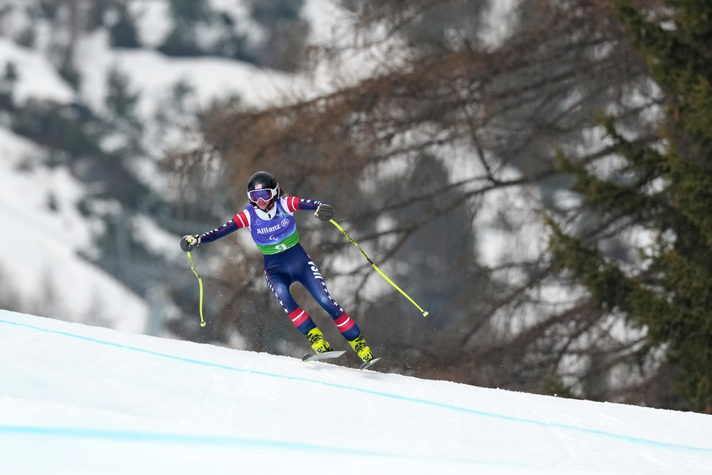 Meg Gustafson, of the United States, competes in the alpine skiing women's alpine combined standing super-G event at the 2026 Winter Paralympics, in Cortina d'Ampezzo, Italy, Tuesday, March 10, 2026. (AP Photo/Evgeniy Maloletka)