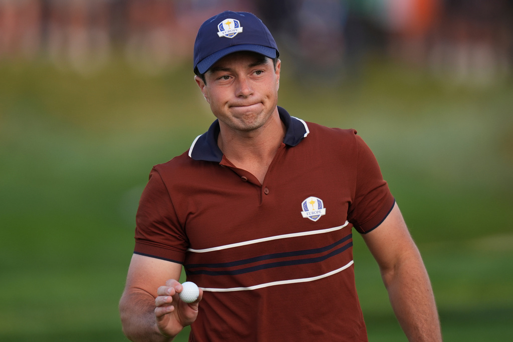 Europe's Viktor Hovland waves after making a putt on the second hole at Bethpage Black golf course during the Ryder Cup golf tournament, Saturday, Sept. 27, 2025, in Farmingdale, N.Y. (AP Photo/Seth Wenig)