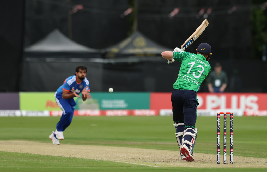 Ireland's Harry Tector, right, bats during the second T20 Test match between Ireland and India in Belfast, Ireland, Sunday, June 28, 2026. (Liam McBurney/PA via AP)