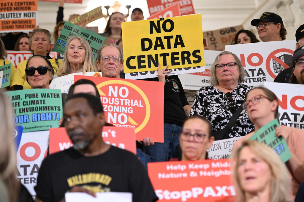 FILE - Anti-data center demonstrators protest at the Pennsylvania state Capitol, Oct. 6, 2026, in Harrisburg, Pa. (AP Photo/Marc Levy, File)