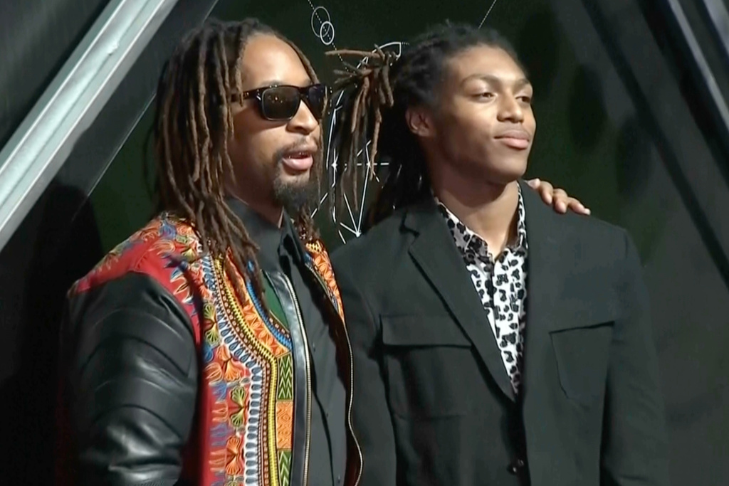 In this image from video, Lil Jon stands with his son, Nathan Smith, in New York, on Oct. 24, 2018. (AP Photo)