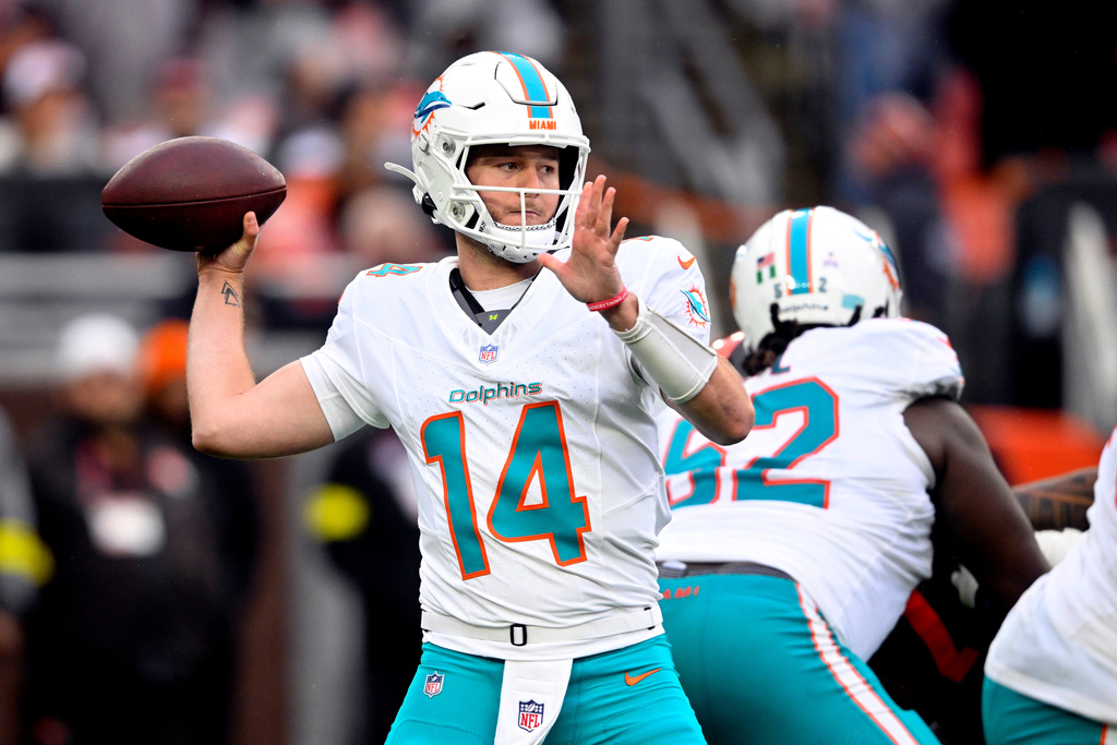 FILE - Miami Dolphins quarterback Quinn Ewers (14) throws a pass during the second half of an NFL football game against the Cleveland Browns, Sunday, Oct. 19, 2025, in Cleveland. (AP Photo/David Richard, File)