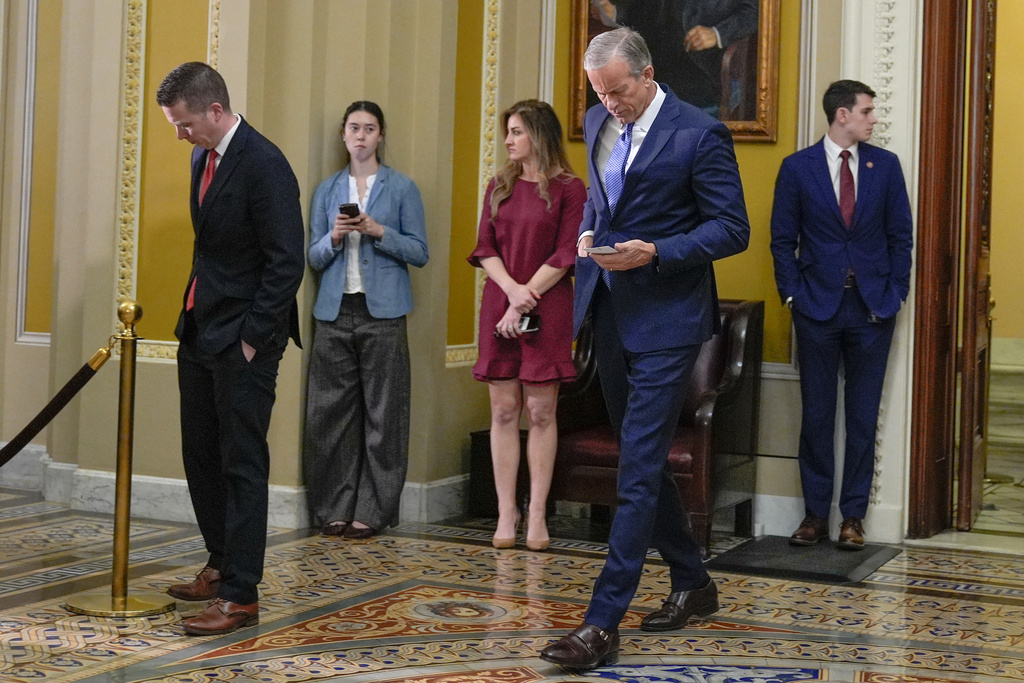 Senate Majority Leader John Thune, R-S.D., center, arrives for a news conference after a policy luncheon on Capitol Hill, Tuesday, Feb. 3, 2026, in Washington. (AP Photo/Mariam Zuhaib)