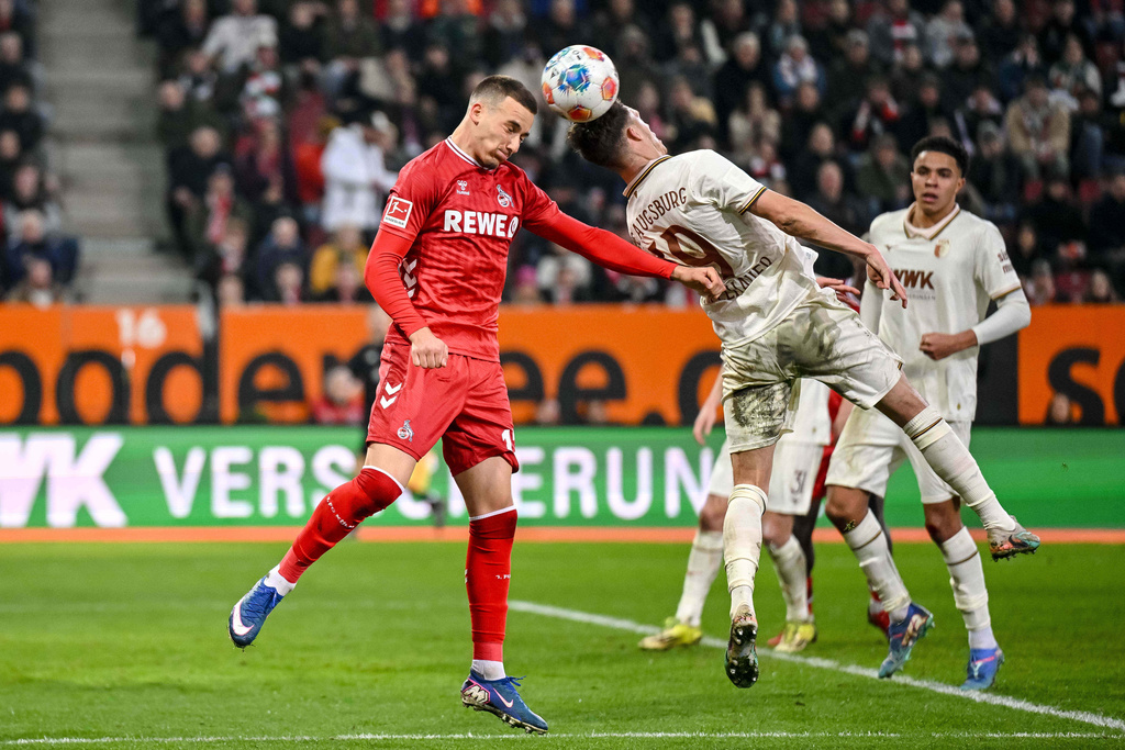 Augsburg's Robin Fellhauer, right, and Cologne's Said El Mala in action during the German Bundesliga soccer match between FC Augsburg and 1. FC Cologne in Augsburg, Germany, Friday, Feb. 27, 2026. (Harry Langer/dpa via AP)