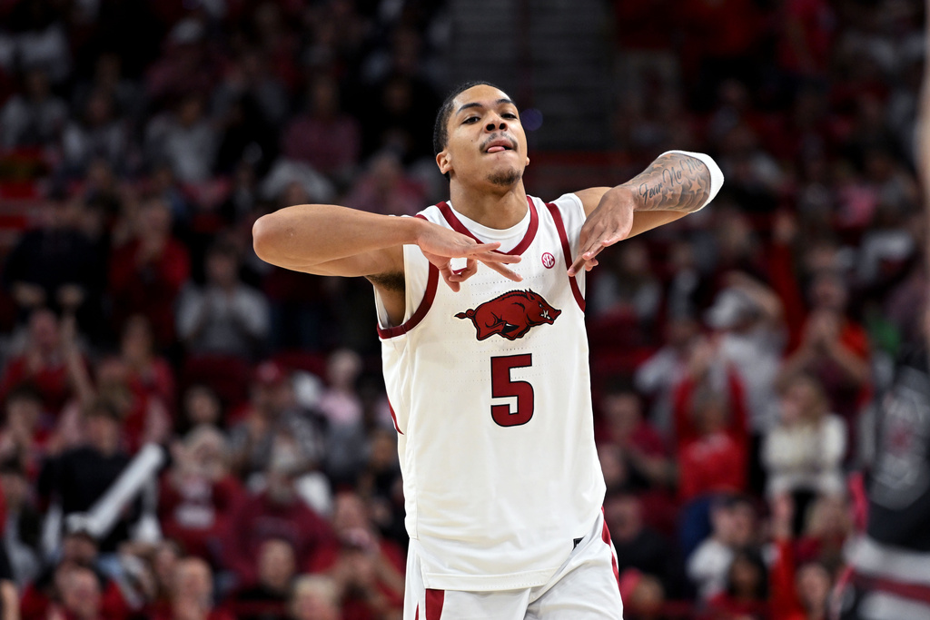Arkansas guard Darius Acuff Jr. (5) reacts after a three point shot against South Carolina during the second half of an NCAA college basketball game Wednesday, Jan. 14, 2026, in Fayetteville, Ark. (AP Photo/Michael Woods)