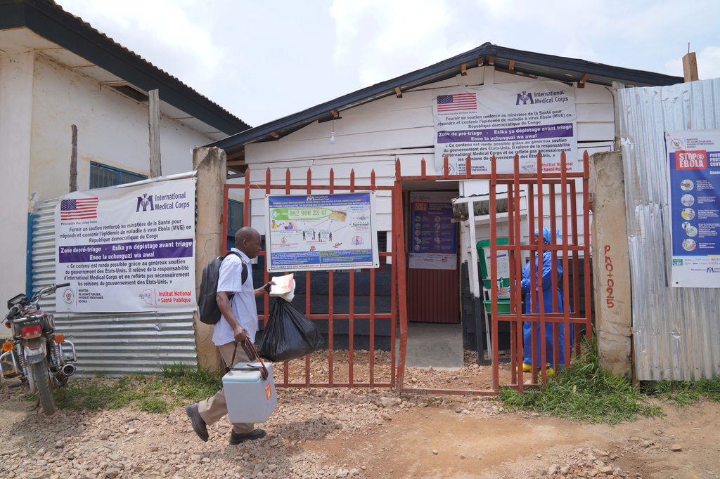A man arrives at the treatment centre in Bunia General Hospital in Ituri, eastern Congo, Tuesday, Aug. 11, 2026. (AP Photo/Dieudonne Dirole)