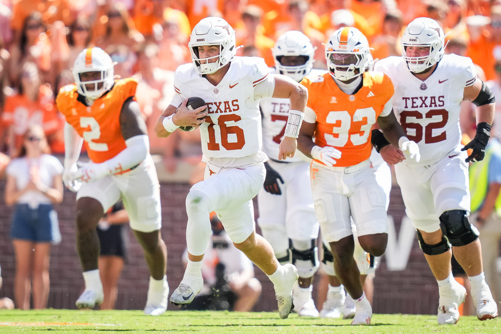 Texas quarterback Arch Manning (16) runs the ball during the first half an NCAA college football game against Tennessee in Knoxville, Tenn., Saturday, Sept. 26, 2026. (Sara Diggins/The San Antonio Express-News via AP)