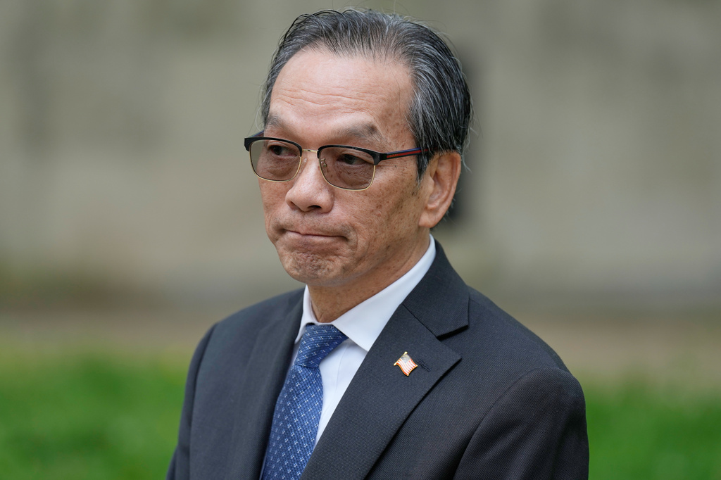 Lu Jianwang waits to enter a federal courthouse in New York, Wednesday, May 6, 2026. (AP Photo/Seth Wenig)