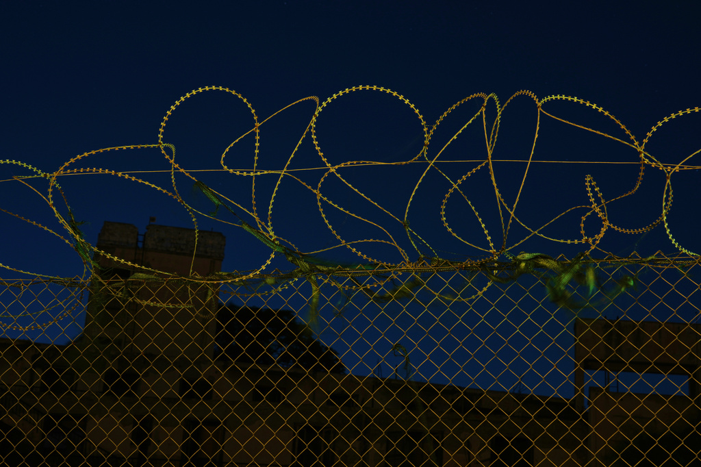 Barbed wires separate the Greek Cypriot south from the Turkish Cypriot north along the U.N.-controlled buffer zone, established after the July 20, 1974 Turkish invasion of Cyprus, in the medieval core of the divided capital of Nicosia, Cyprus, on July 16, 2026. (AP Photo/Petros Karadjias)