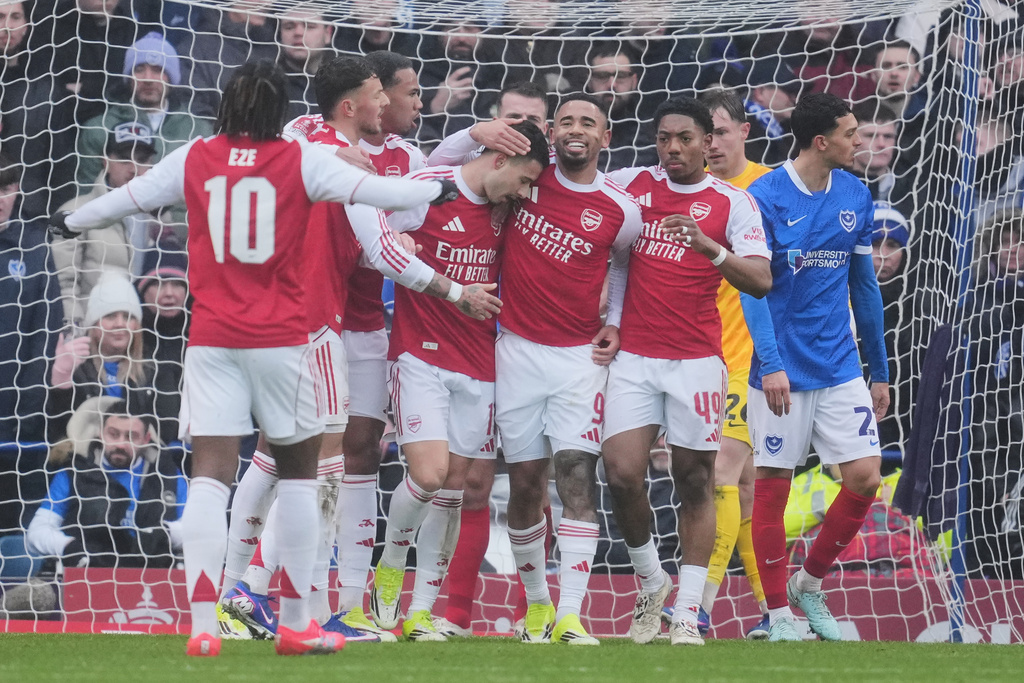 Arsenal players celebrate after a goal during the FA Cup third round soccer match between Portsmouth and Arsenal in Portsmouth, England, Sunday, Jan. 11, 2026. (AP Photo/Kin Cheung)